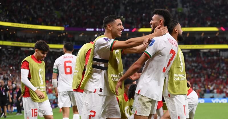 Jogadores de Marrocos celebram vitória sobre a Bélgica