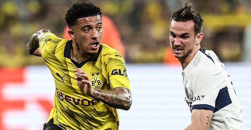 Jadon Sancho e Fabian Ruiz em disputa de bola no Borussia Dortmund-PSG.