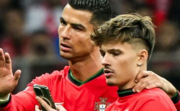 Cristiano Ronaldo e o adepto que invadiu o Polónia-Portugal.